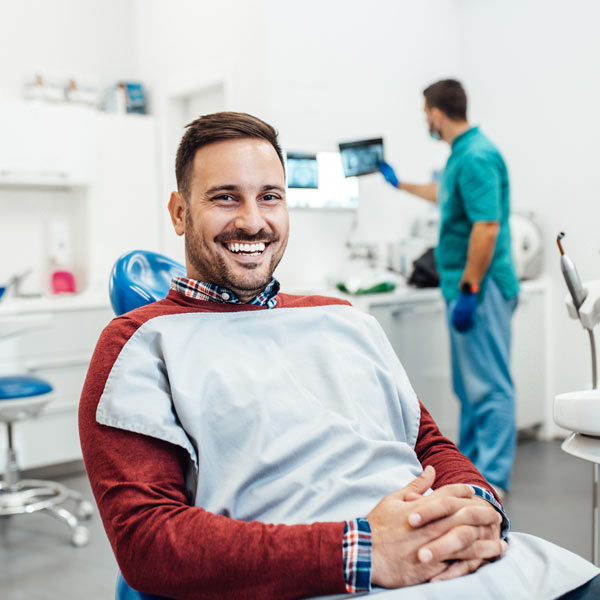 man sitting at dentist chair