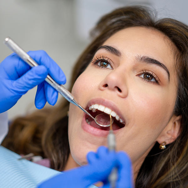 dentist examining patient's teeth